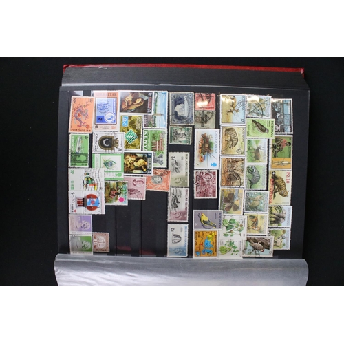 422 - A collection of British, Commonwealth and world stamps contained within over thirteen albums.