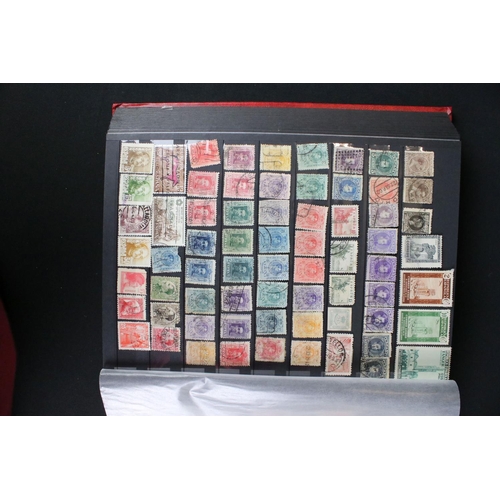 422 - A collection of British, Commonwealth and world stamps contained within over thirteen albums.