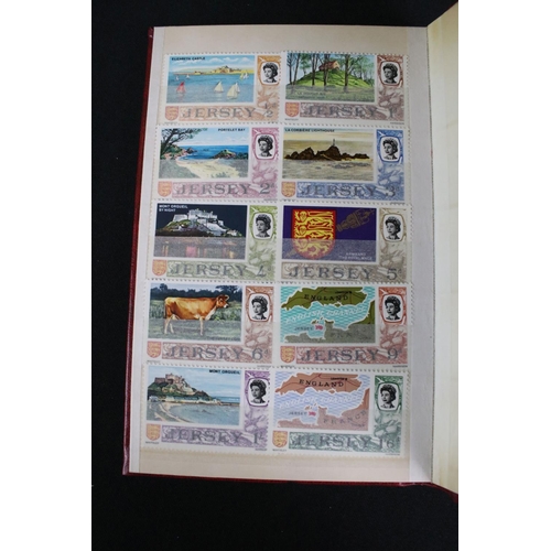 422 - A collection of British, Commonwealth and world stamps contained within over thirteen albums.