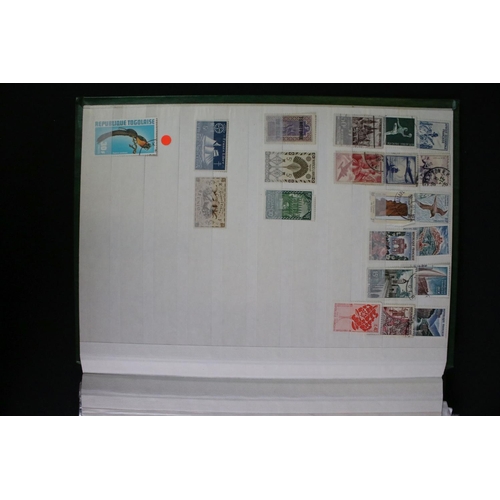 422 - A collection of British, Commonwealth and world stamps contained within over thirteen albums.