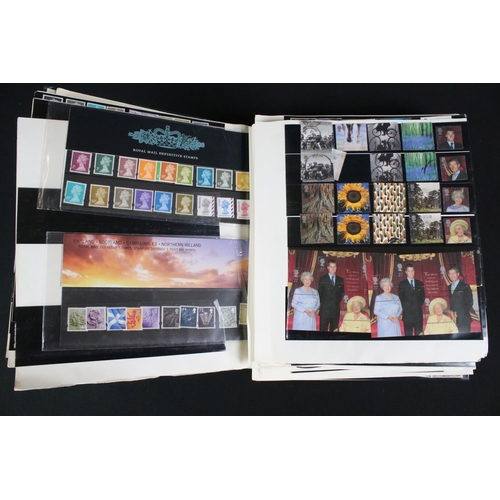 422 - A collection of British, Commonwealth and world stamps contained within over thirteen albums.