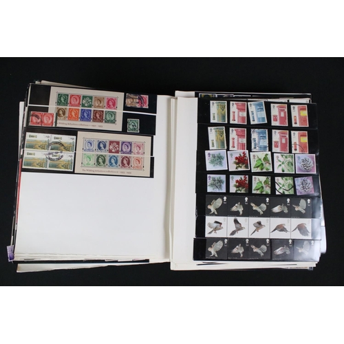 422 - A collection of British, Commonwealth and world stamps contained within over thirteen albums.