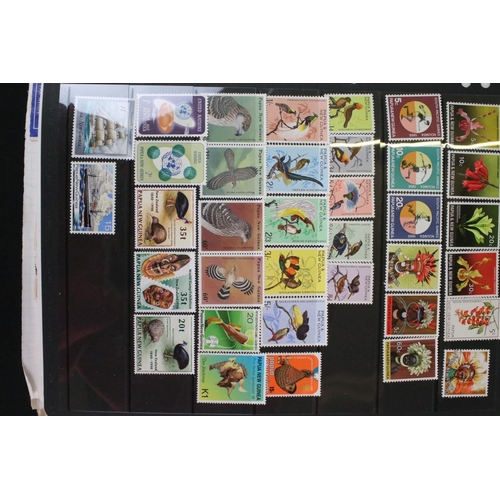 423 - A large collection of mainly world stamps mounted to sheets and contained within nine binders.