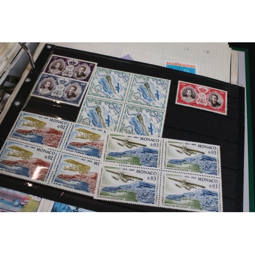 423 - A large collection of mainly world stamps mounted to sheets and contained within nine binders.