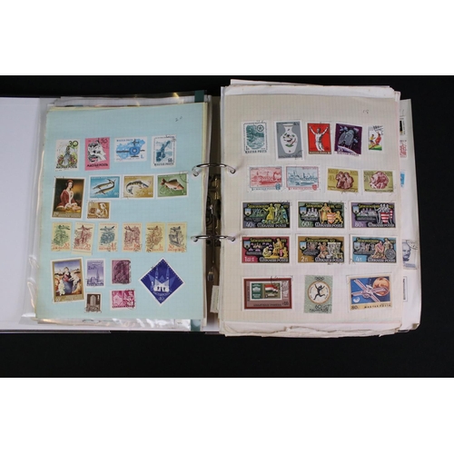 423 - A large collection of mainly world stamps mounted to sheets and contained within nine binders.