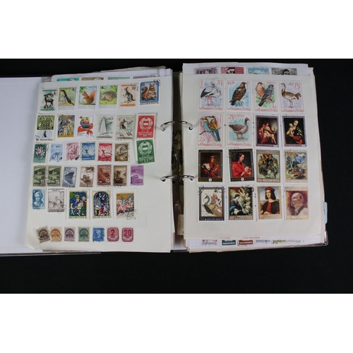 423 - A large collection of mainly world stamps mounted to sheets and contained within nine binders.