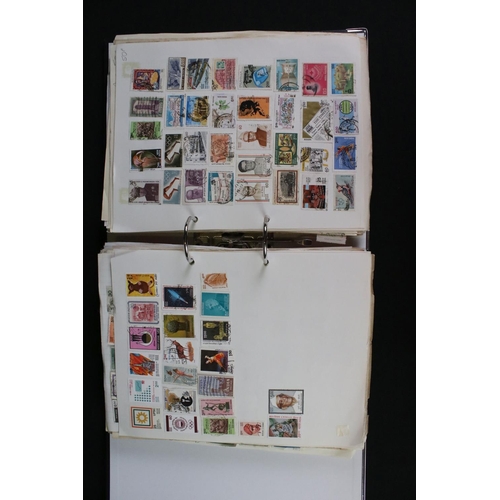 423 - A large collection of mainly world stamps mounted to sheets and contained within nine binders.