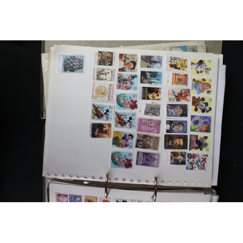 423 - A large collection of mainly world stamps mounted to sheets and contained within nine binders.