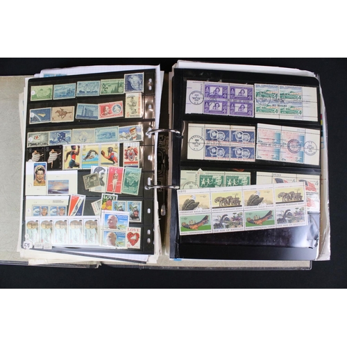 423 - A large collection of mainly world stamps mounted to sheets and contained within nine binders.