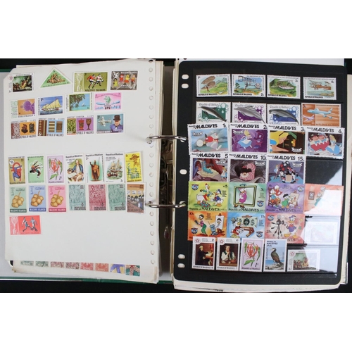 423 - A large collection of mainly world stamps mounted to sheets and contained within nine binders.