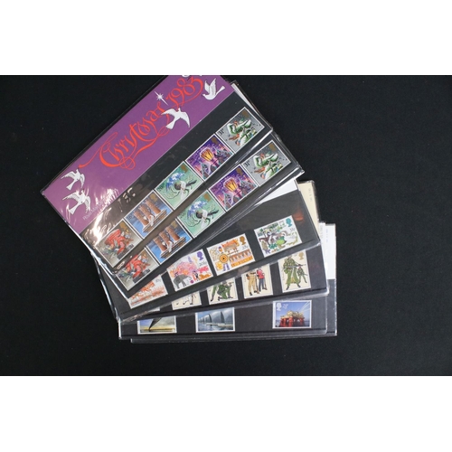 433 - A large collection of Royal Mail presentation packs together with other mint stamps.