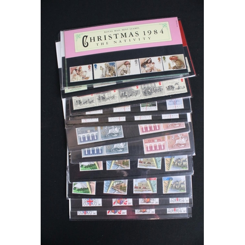 433 - A large collection of Royal Mail presentation packs together with other mint stamps.