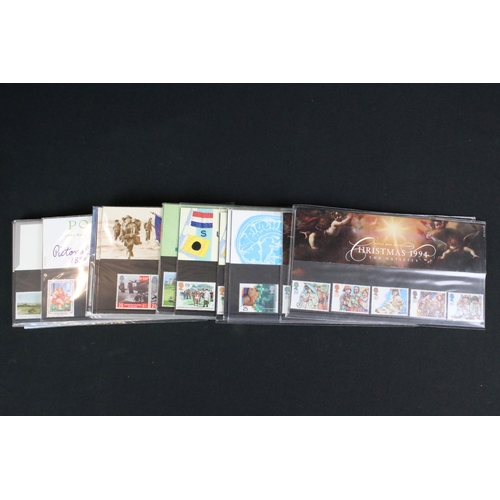 433 - A large collection of Royal Mail presentation packs together with other mint stamps.