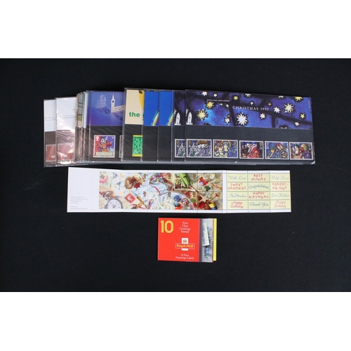 433 - A large collection of Royal Mail presentation packs together with other mint stamps.