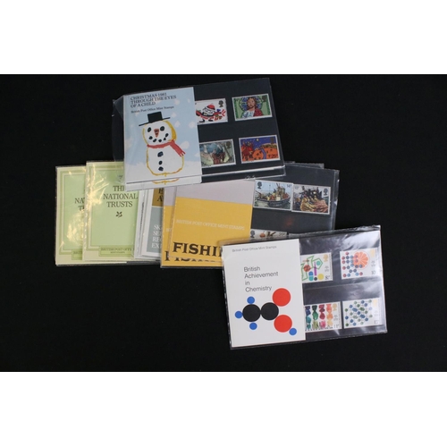 433 - A large collection of Royal Mail presentation packs together with other mint stamps.