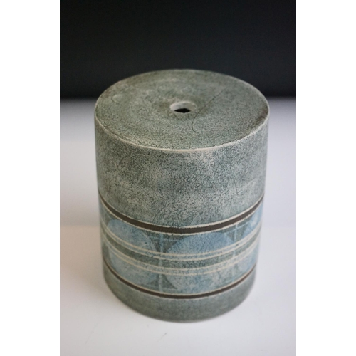 14 - Troika pottery cylindrical lamp base decorated with a striped band of circles on a textured grey gro... 