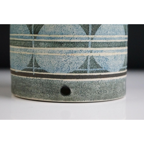 14 - Troika pottery cylindrical lamp base decorated with a striped band of circles on a textured grey gro... 