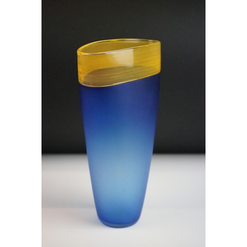 9 - Bob Crooks - A blue & pale amber threaded glass vase of flattened tapering form, with a fine threade... 