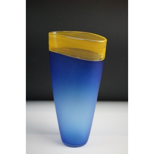 9 - Bob Crooks - A blue & pale amber threaded glass vase of flattened tapering form, with a fine threade... 