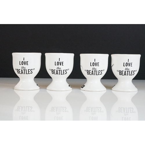 211 - Set of Four Ceramic ' The Beatles ' Egg Cups, each cup featuring a different member of the band and ... 