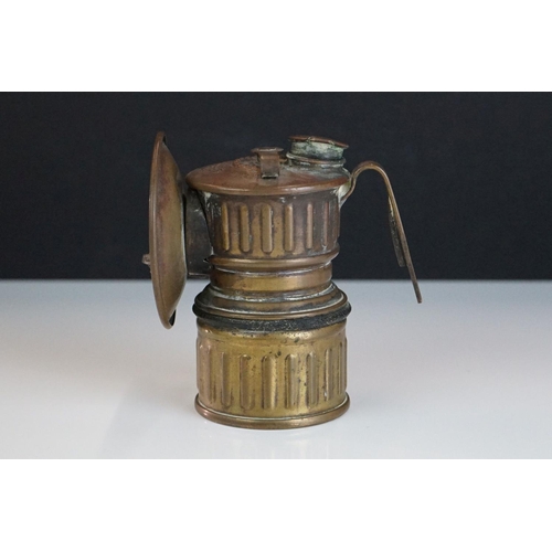 215 - An antique brass 'Victor' carbide bicycle / pot-holing lamp.