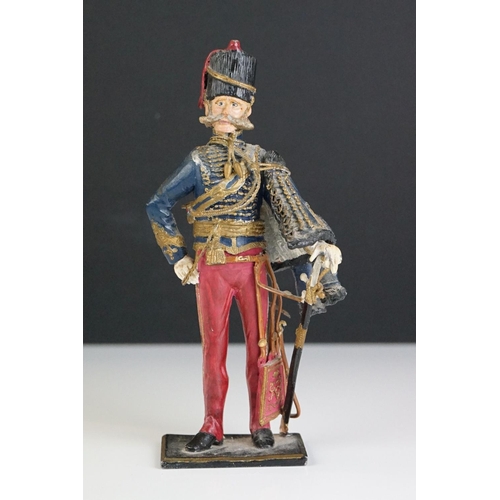 216 - A decorative painted metal soldier in traditional uniform.