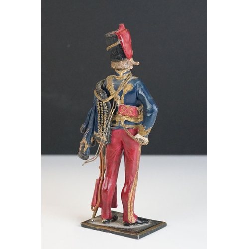 216 - A decorative painted metal soldier in traditional uniform.