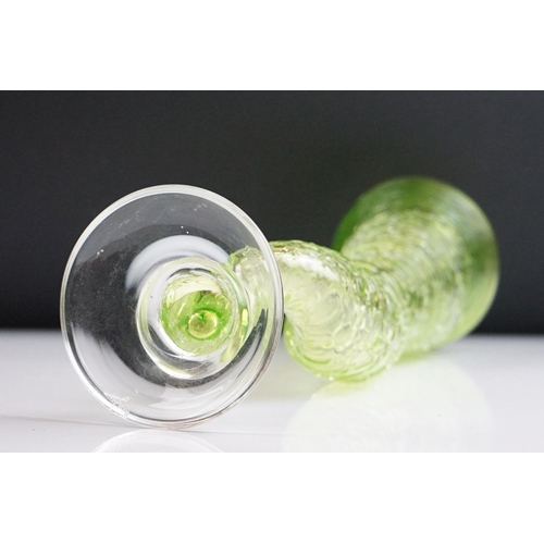 21 - Bob Crooks for First Glass - ' Tornado ' studio green glass vase, with a clear crystal domed foot ri... 