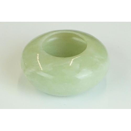 217A - Chinese Jade Brush Washer of compressed circular form on a slightly raised base, 6.5cm diameter x 3c... 