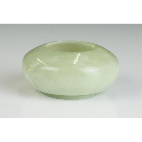 217A - Chinese Jade Brush Washer of compressed circular form on a slightly raised base, 6.5cm diameter x 3c... 