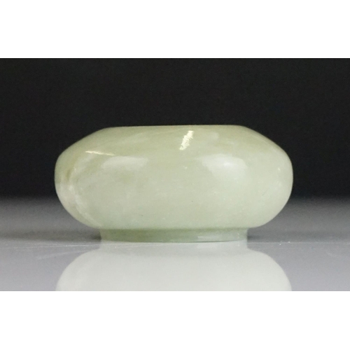 217A - Chinese Jade Brush Washer of compressed circular form on a slightly raised base, 6.5cm diameter x 3c... 