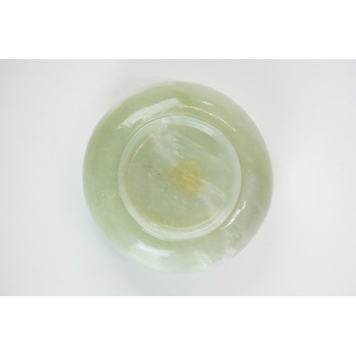 217A - Chinese Jade Brush Washer of compressed circular form on a slightly raised base, 6.5cm diameter x 3c... 