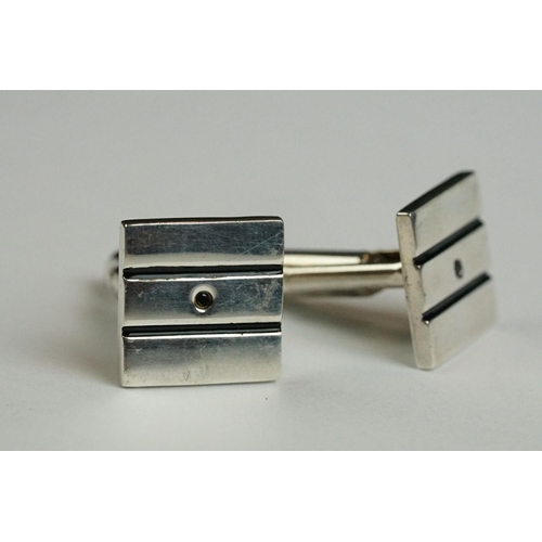 234 - Two pairs of contemporary fully hallmarked sterling silver cufflinks.