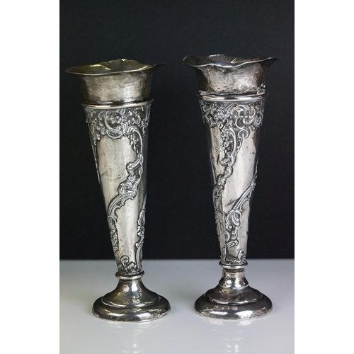 246 - A pair of fully hallmarked sterling silver bud vases together with a white metal cigarette case.