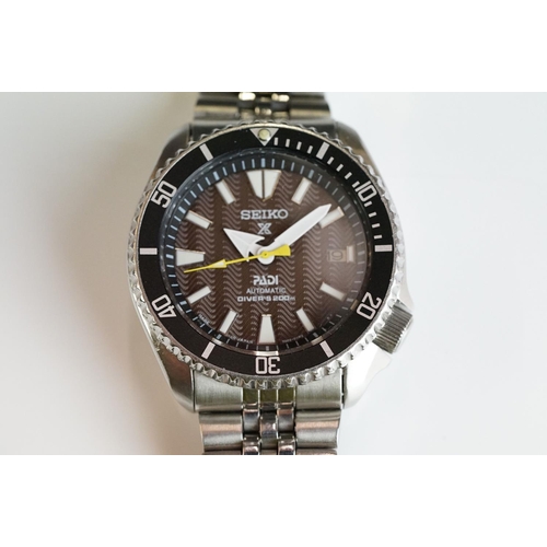 251 - A Seiko PADI automatic divers watch with brown dial, 7002-7000 complete with original bracelet strap... 