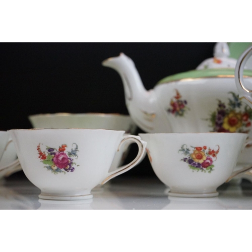 29 - Early 20th Century English porcelain floral tea set in pale green & white with gilt detailing, patte... 