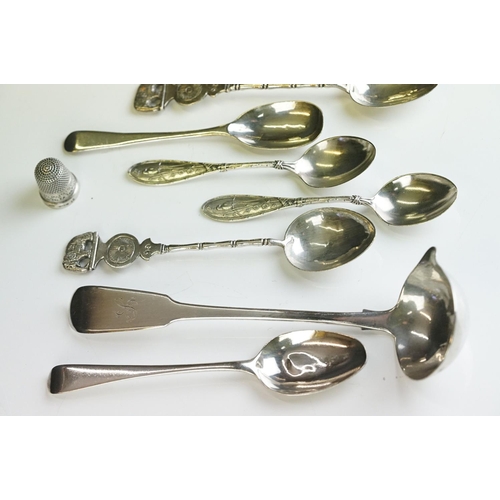 253 - A small group of mixed collectables to include hallmarked sterling silver spoons, costume jewellery ... 