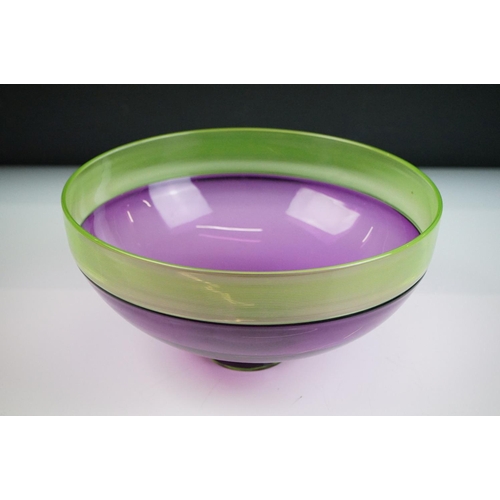 34 - Bob Crooks - Two threaded studio glass bowls to include a lime green & aubergine example, with a fin... 