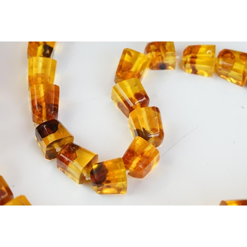 260 - An amber style beaded necklace and bracelet together with similar earrings.