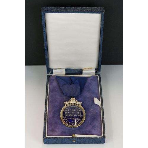 273 - A fully hallmarked sterling silver and enamel medal from the licensed victuallers association.