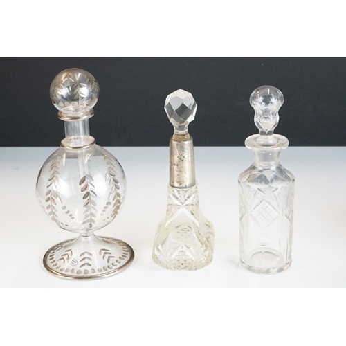 327 - A collection of mainly vintage scent / perfume bottles to include a fully hallmarked sterling silver... 