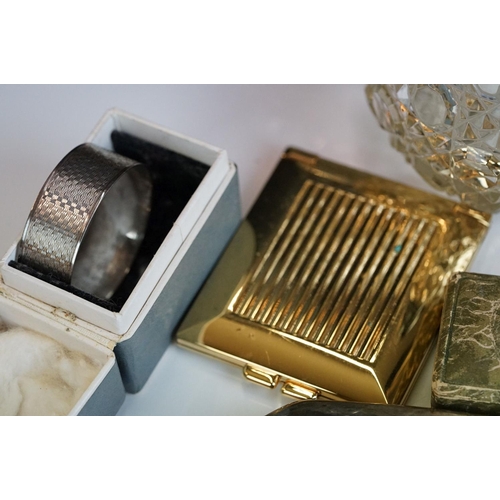 262 - A box of mixed collectables to include a hallmarked sterling silver bud vase, napkin ring, silver to... 