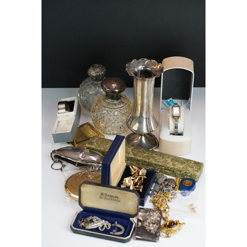 262 - A box of mixed collectables to include a hallmarked sterling silver bud vase, napkin ring, silver to... 