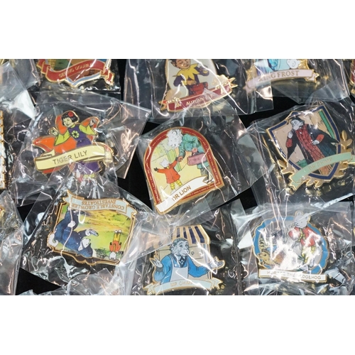 293 - A large collection of over fifty collectable Rupert The Bear pin badges contained within a glass top... 