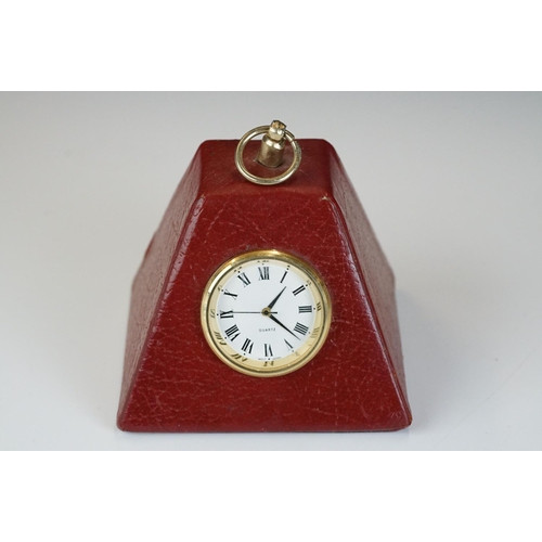 281 - A weighted red leather Smythson desk clock together with a small group of watches.