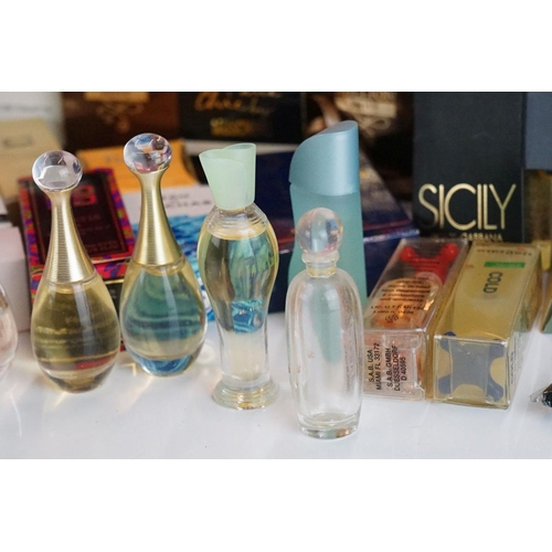 304 - A collection of perfume and make up factory sample packs to include Givenchy, Dolce & Gabbana, Rocha... 