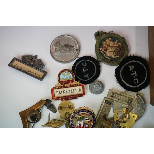 294 - A box of mixed collectables to include pocket lighters, die cast vehicles, badges and coins to inclu... 