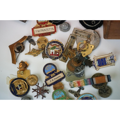 294 - A box of mixed collectables to include pocket lighters, die cast vehicles, badges and coins to inclu... 