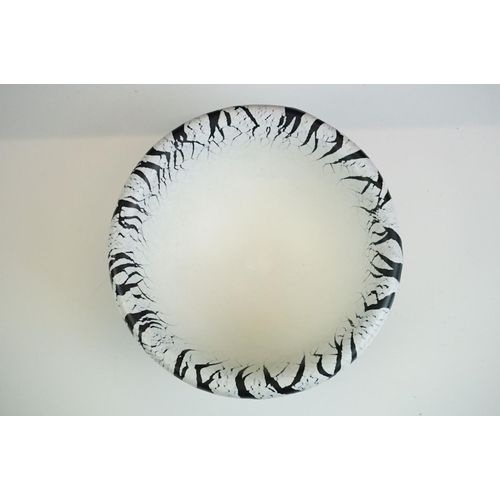 42 - Malcolm Sutcliffe - Studio glass bowl with black & white overlay, crazed effect to rim, raised on a ... 