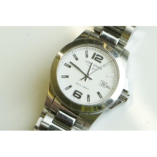 282 - A collection of gents and ladies wristwatches to include Citizen and Swatch examples.